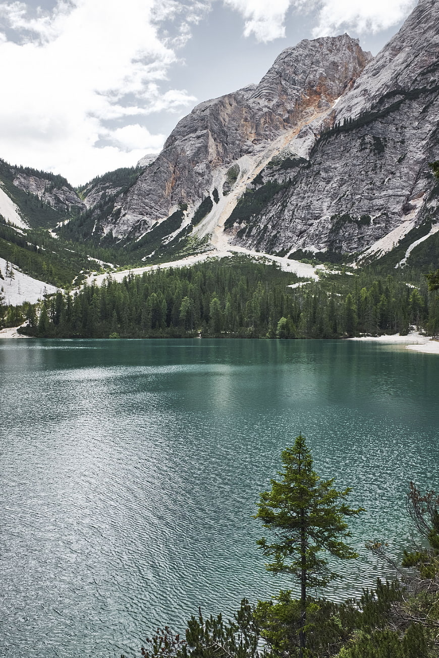 Serene Alpine Lake Surrounded by Majestic Rocky Mountains