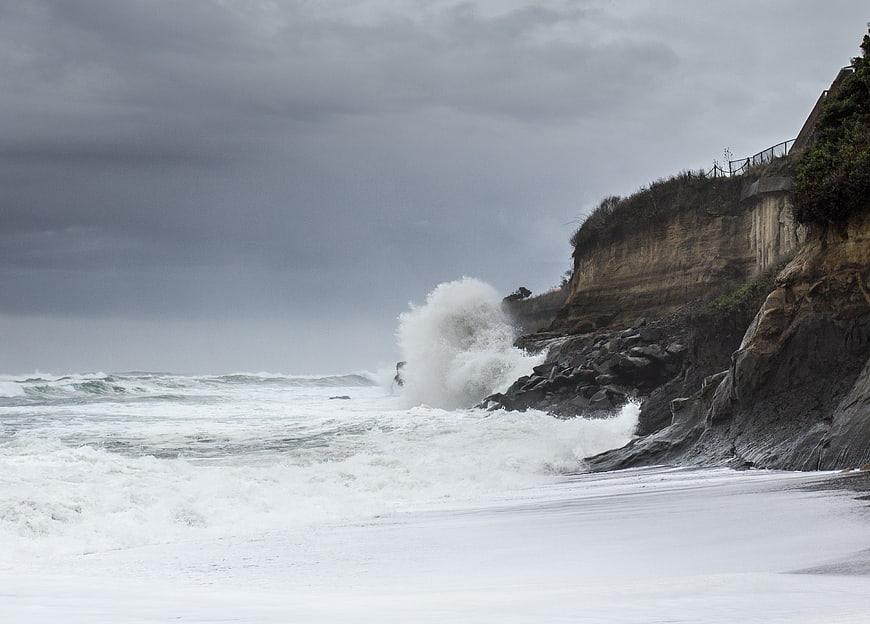 Stormy Ocean Waves Crashing Against Rocky Coastal Cliffs