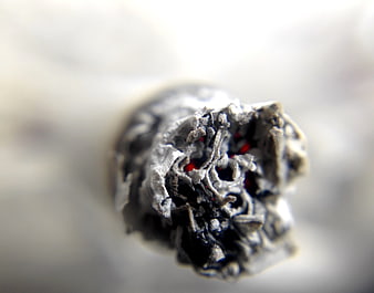 Macro Close-Up of Burning Cigarette Tip with Glowing Embers