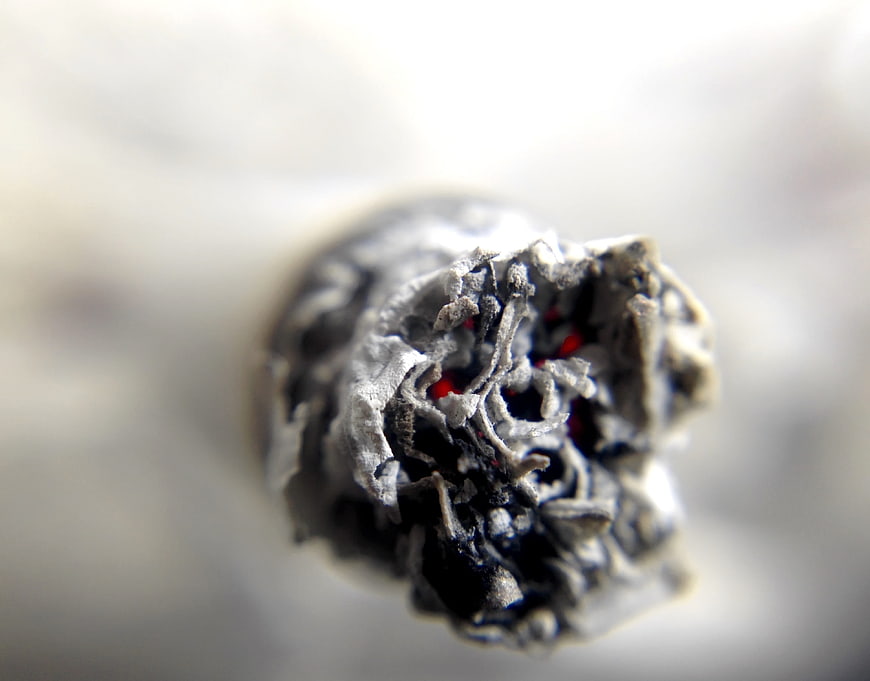 Macro Close-Up of Burning Cigarette Tip with Glowing Embers