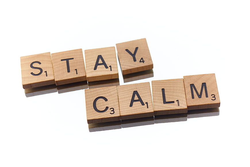 Wooden Scrabble Tiles Spelling Stay Calm on White Background