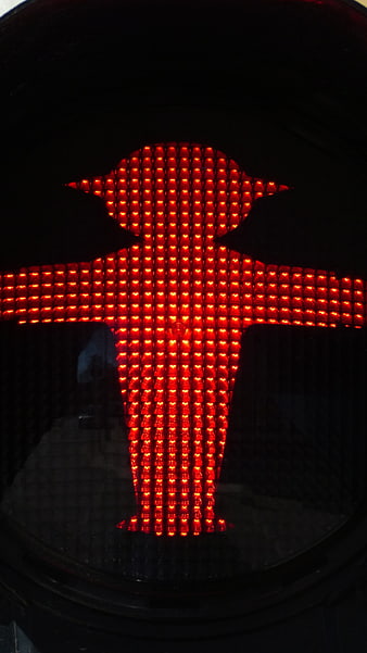 Close-up of red East German Ossi traffic light pedestrian signal
