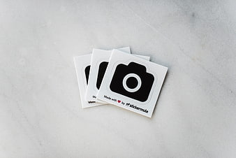 Camera Icon Stickers on White Marble Surface