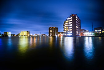Night cityscape of Zaandam with building reflections on water