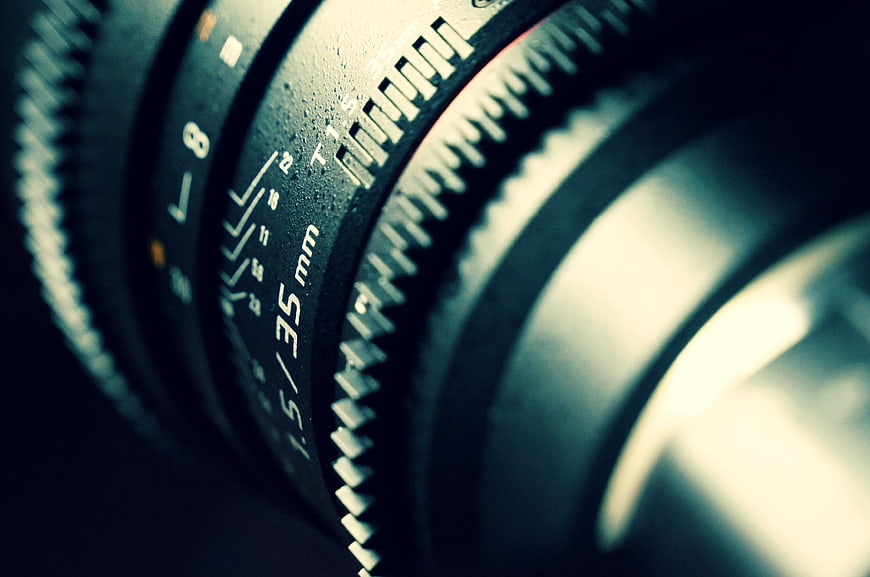 Close-up of vintage camera lens with 35mm focal length markings