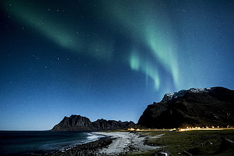 Aurora Borealis over Norwegian Coastal Mountains at Night