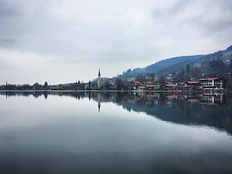 Serene Lake Hallstatt Reflection with Church Spire and Mountains