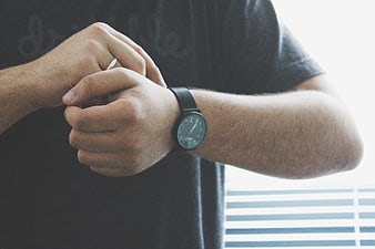 Man Checking Time on Wristwatch