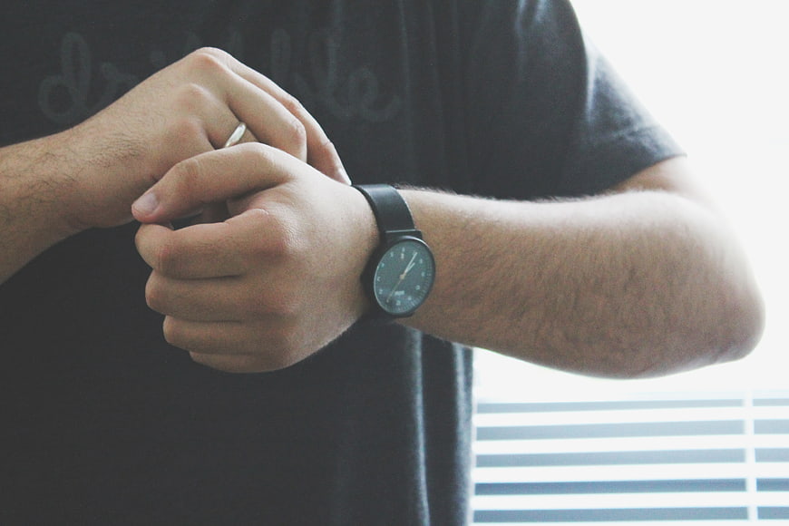 Man Checking Time on Wristwatch