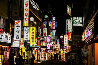 Vibrant Night Street Scene in Seoul with Neon Signs