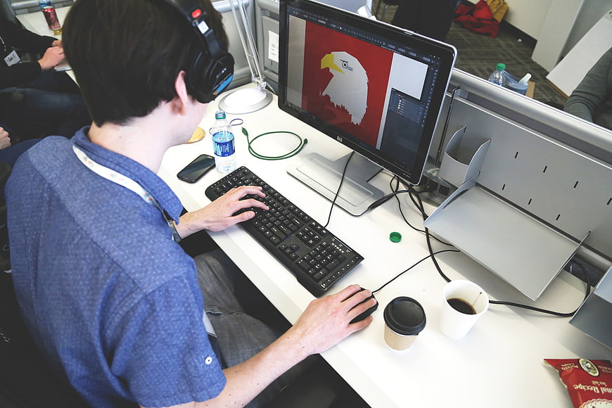 Graphic Designer Working on Computer in Office