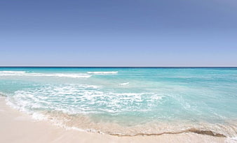 Turquoise Caribbean Beach with White Sand and Clear Blue Sky
