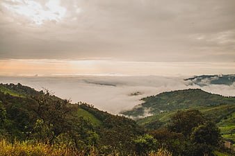 Misty Mountain Landscape with Sea of Clouds at Sunrise