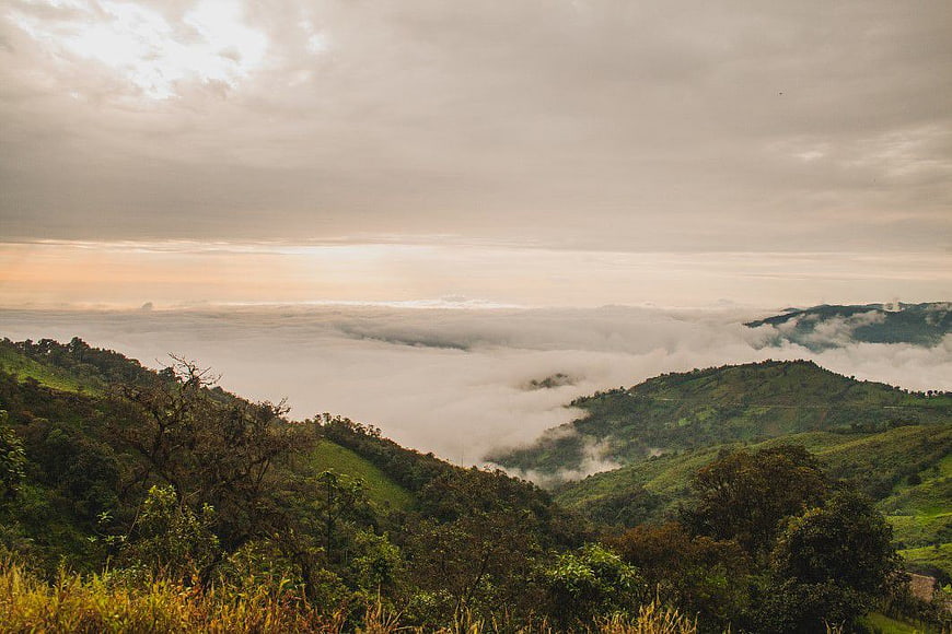 Misty Mountain Landscape with Sea of Clouds at Sunrise