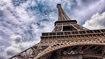 Low Angle View of Eiffel Tower Against Dramatic Cloudy Sky