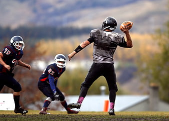 American Football Quarterback Throwing Pass in Action