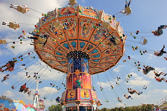Colorful Swinging Carousel Ride At Amusement Park Festival