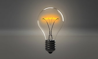 Glowing Vintage Light Bulb on Gray Background