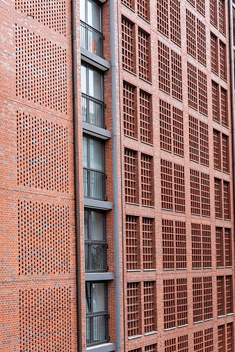 Modern Red Brick Building Facade with Geometric Patterns