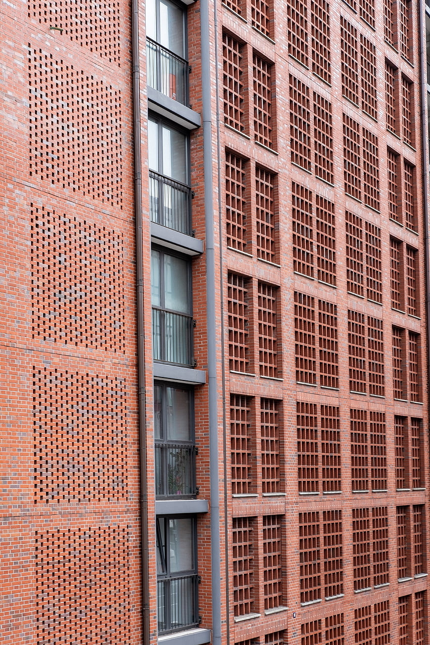 Modern Red Brick Building Facade with Geometric Patterns