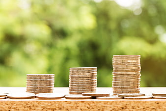 Stacks of gold coins representing financial growth and savings