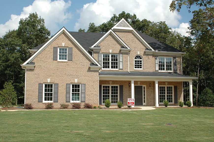 New Brick Home For Sale With Open House Sign