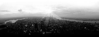 Panoramic Black and White New York City Skyline with Sun Rays