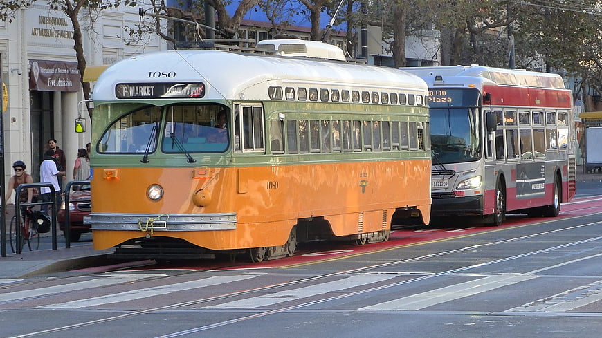 Vintage orange and green streetcar on San Francisco tracks