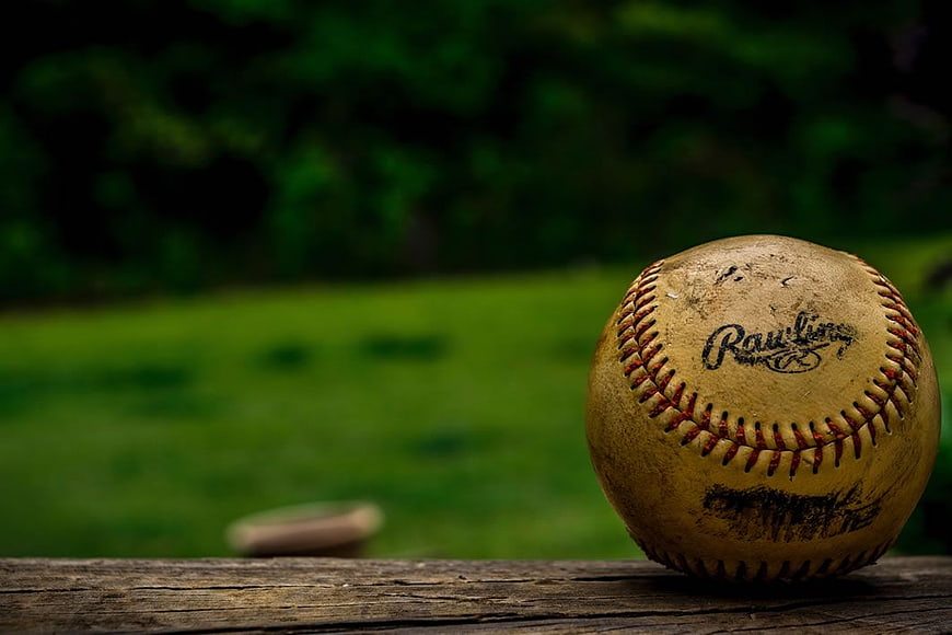 Vintage Baseball on Wooden Fence