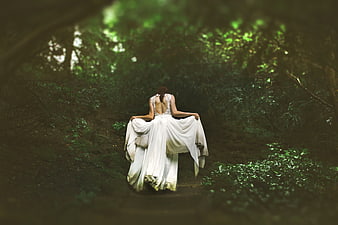Woman in White Dress Walking Away in Dark Forest