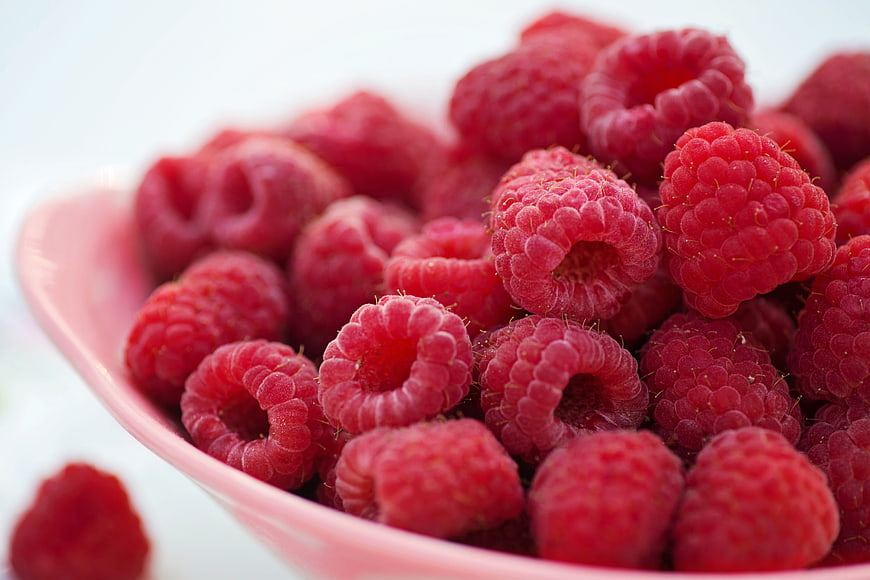 Fresh Raspberries in Pink Bowl Close Up