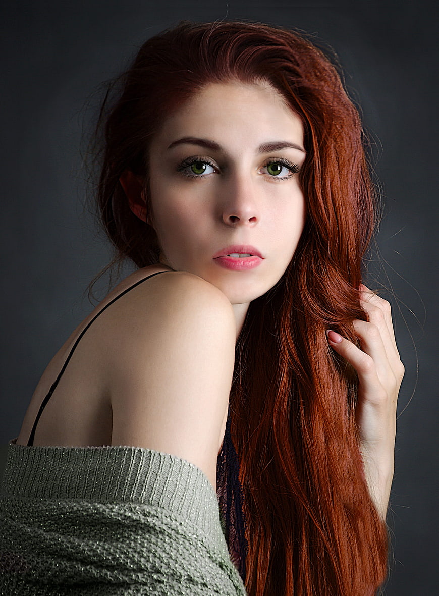 Studio Portrait of Young Woman With Red Hair