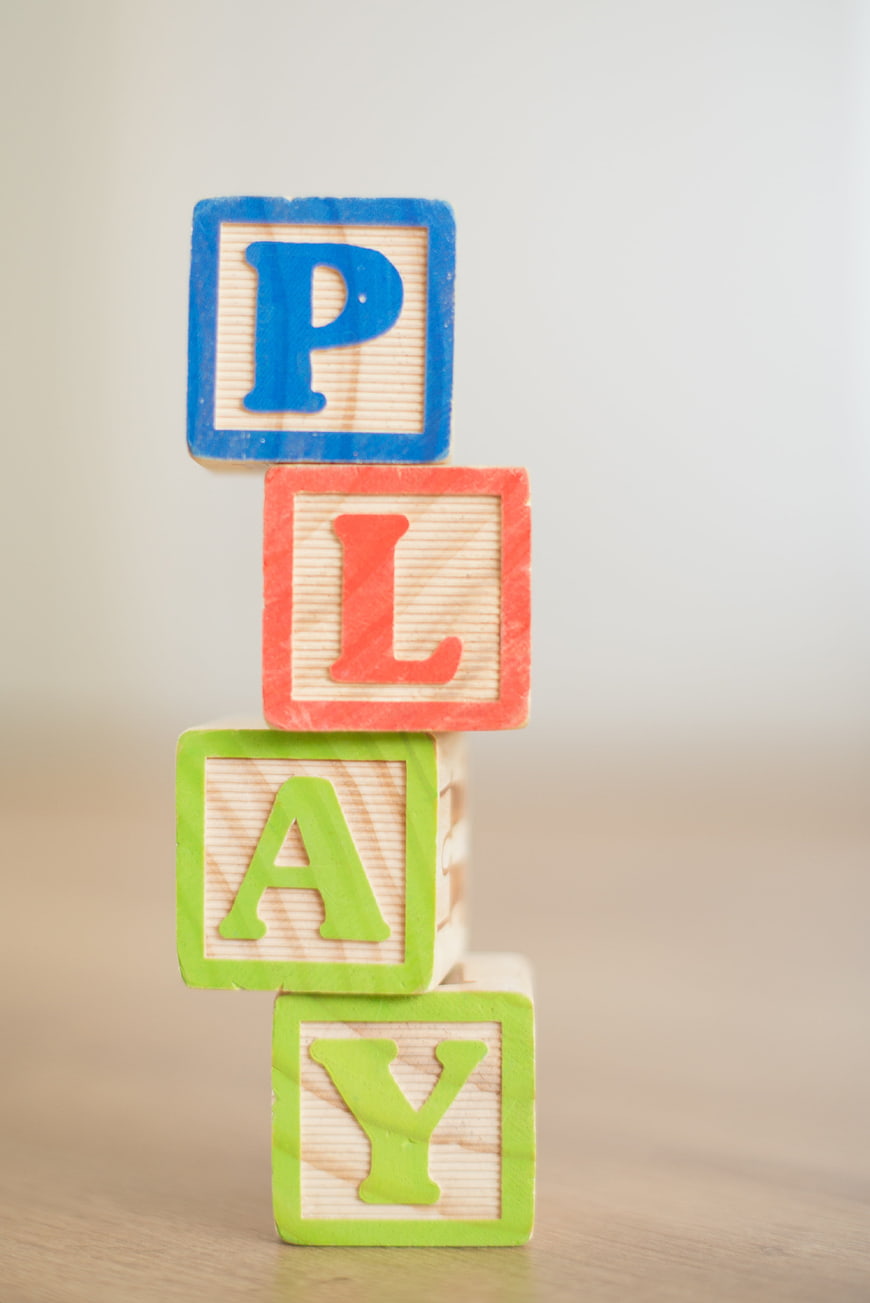 Stacked Wooden Blocks Spelling Play on Table
