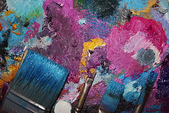 Colorful Artist Palette with Paint Brushes and Thick Oil Paint