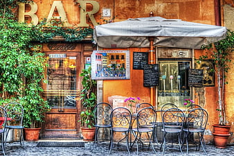 Charming European Bar Facade with Outdoor Seating