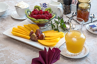 Healthy breakfast spread with fresh fruit and orange juice