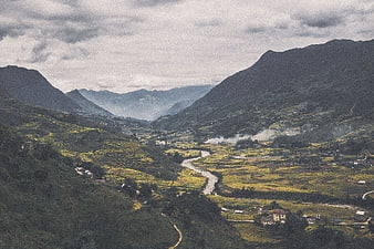 Scenic Mountain Valley with Terraced Rice Fields and River