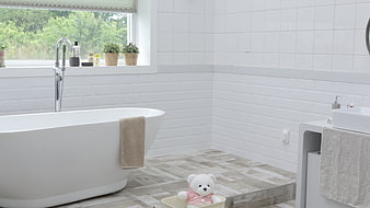 Modern white bathroom with freestanding tub and window