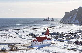 White Church with Red Roof in Snowy Icelandic Village
