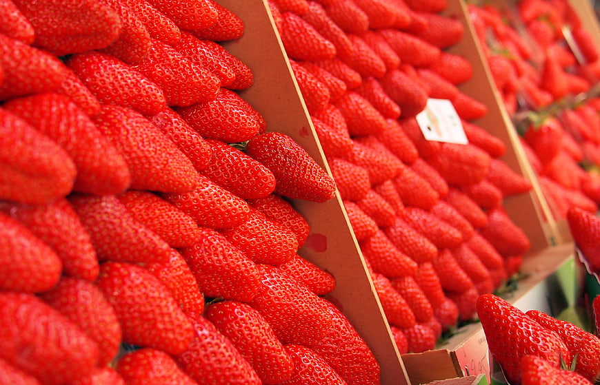 Fresh Red Strawberries in Cardboard Boxes at Market