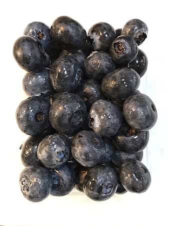 Fresh Blueberries in Glass on White Background