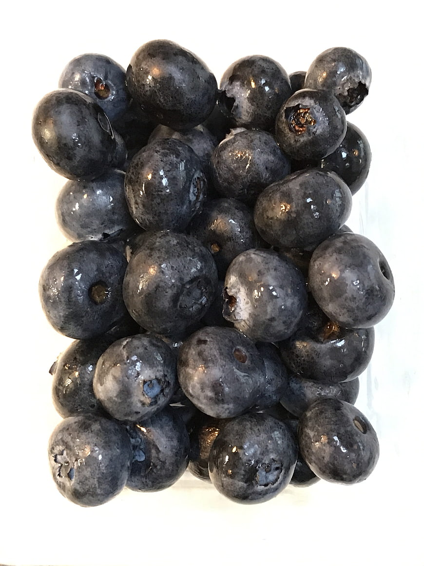 Fresh Blueberries in Glass on White Background