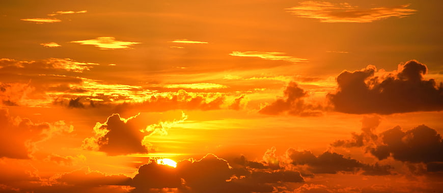 Dramatic Orange Sunset Sun Rays Through Clouds