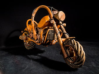 Handcrafted Wooden Motorcycle Sculpture on Black Background