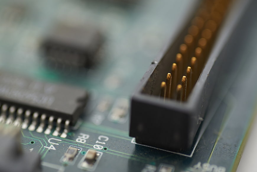 Macro shot of computer circuit board connector pins