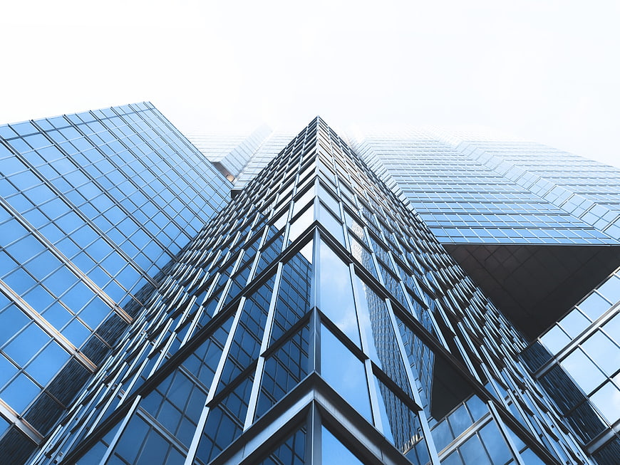 Low-Angle View of Modern Glass Skyscraper Facade