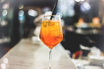 Orange Cocktail with Ice on Bar Counter