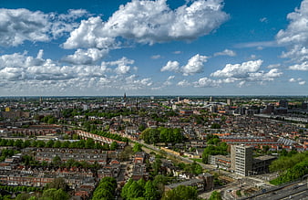 Aerial view of Groningen cityscape with blue sky and clouds