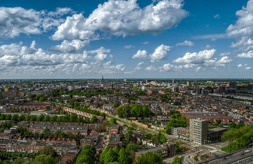Aerial view of Groningen cityscape with blue sky and clouds