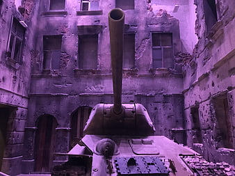 Military tank in ruined building with purple lighting